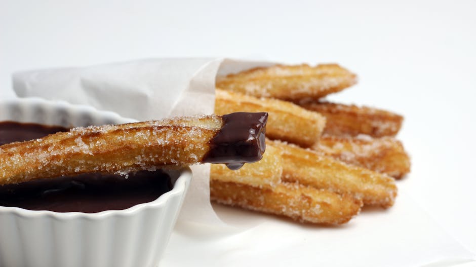 Churros bañados en chocolate derretido